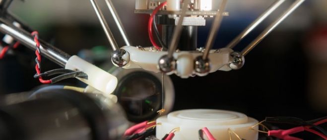 A fruit fly hangs unharmed at the end of the robot's suction tube. The robot uses machine vision to inspect and analyze the captured fly. (Photo: L.A. Cicero/Stanford News)